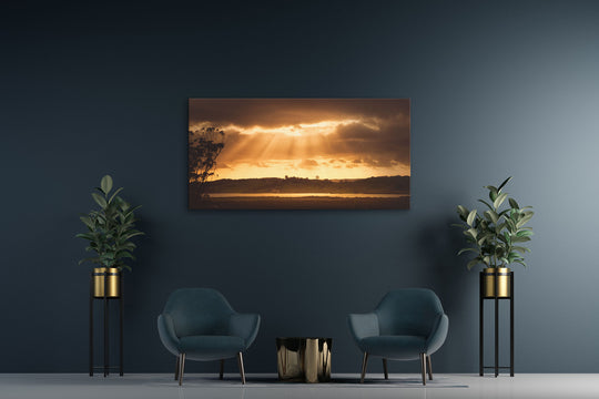 New Zealand landscape canvas photo print on a dark wall with two blue chairs and two pot plants