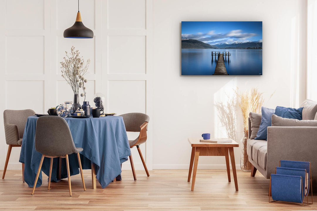 canvas wall art on display with dining table and chairs, couch and coffee table in the room