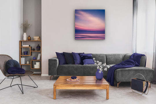 Abstract printed photo on a neutral lounge wall of a Canterbury beach at sunset.