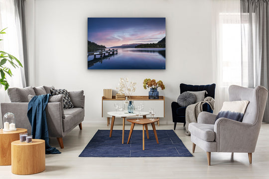 Canvas photo print on the wall of a modern lounge setting with chairs, couch and coffee table