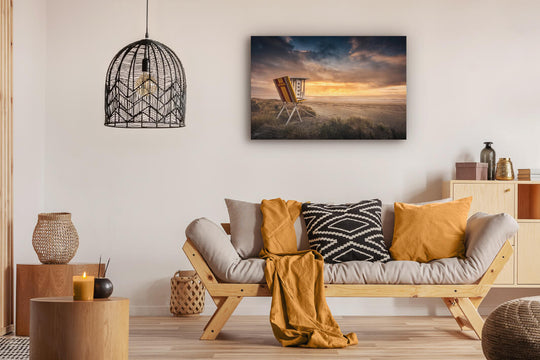 Canvas photo wall art of New Zealand landscape canvas print in lounge setting with a couch, cushions, coffee tables, and pendant light.