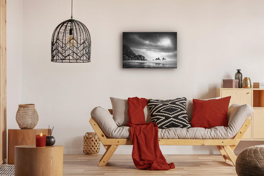Canvas photo wall art of New Zealand landscape canvas print in lounge setting with a couch, cushions, coffee tables, and pendant light.