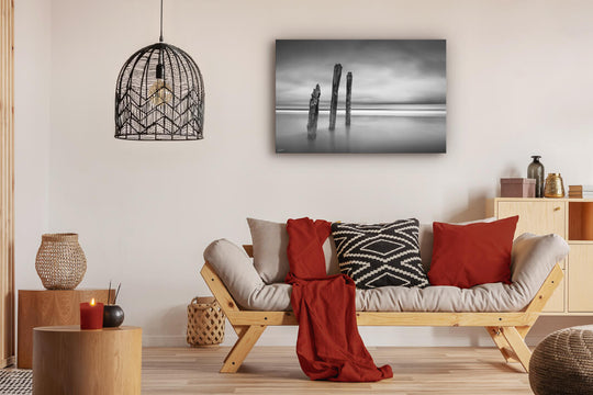 Canvas photo wall art of New Zealand landscape canvas print in lounge setting with a couch, cushions, coffee tables, and pendant light.