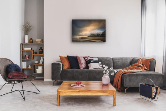Contemporary lounge with couch and bookcase with New Zealand West Coast landscape photo canvas print on the wall