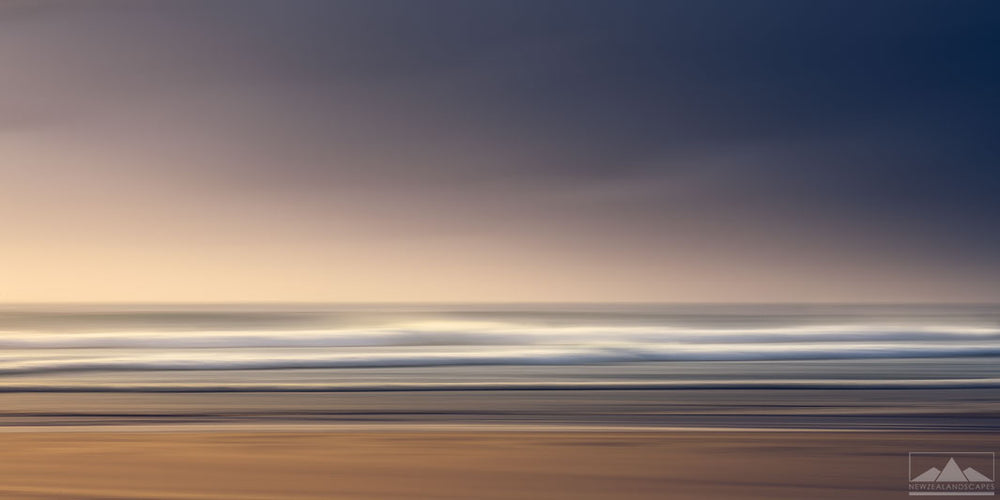 Panorama landscape photo of a beach, straight lines of beach, waves, sand and sky