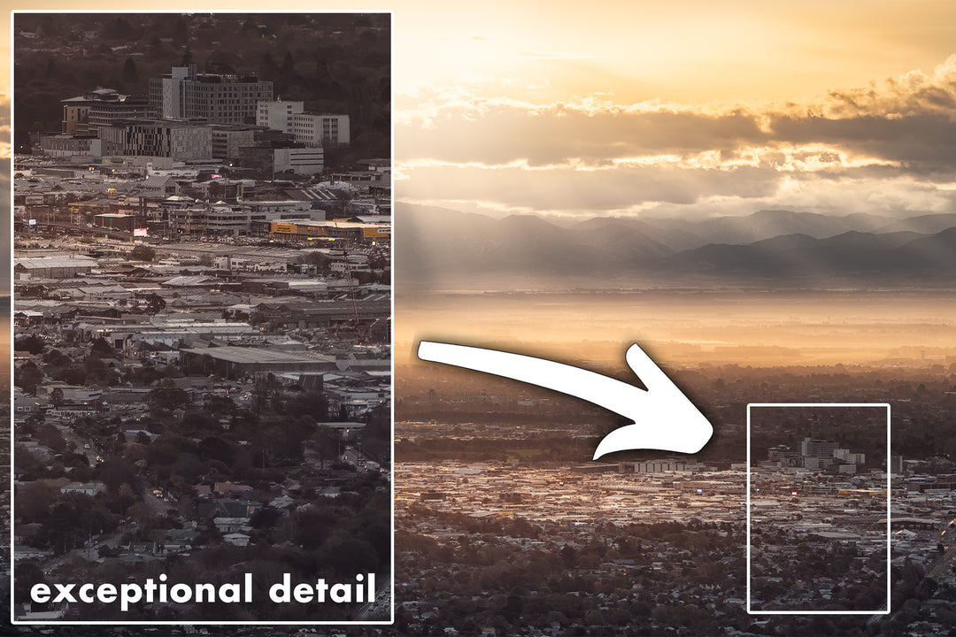 Highly detailed panoramic cityscape photo of Christchurch in the evening, with sunbeams through the clouds