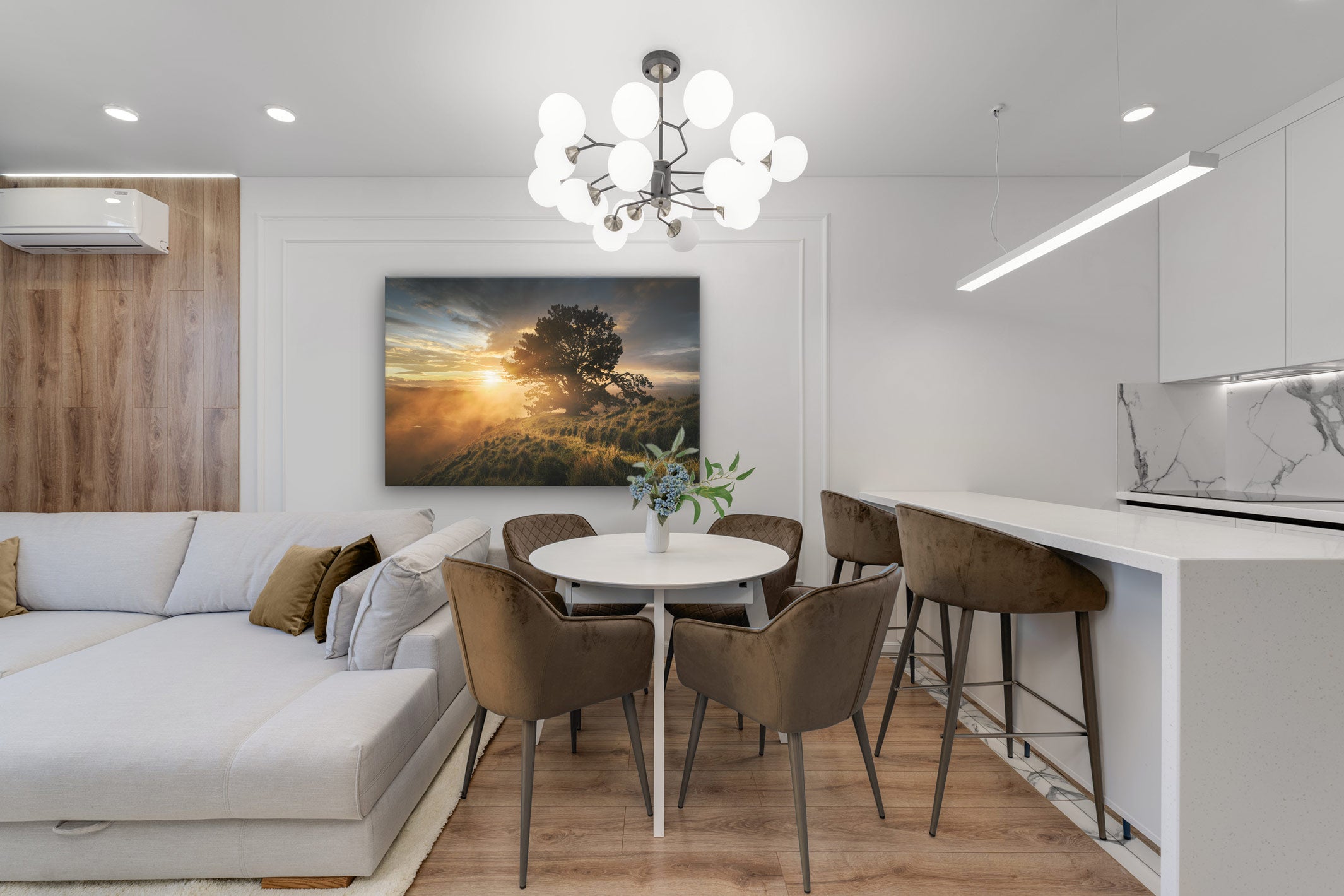 New Zealand landscape on canvas on a wall in a dining room with dining table & chairs, barstool, kitchen and large pendant light