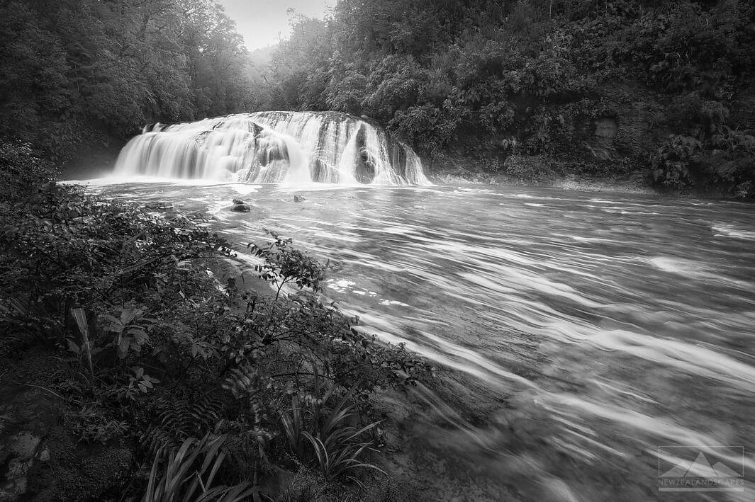 Black and white long exposure photograph of Coal Creek Falls, West Coast, New Zealand