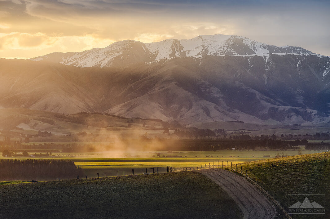 Sun setting behind mountains near Geraldine. Buy a photo print or canvas print for your wall.