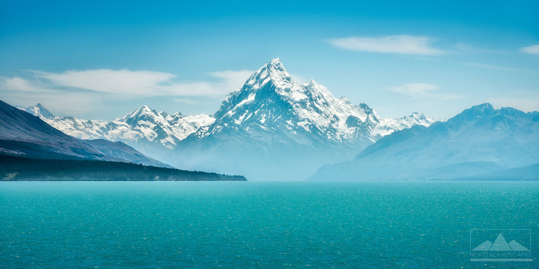 Clear image of snow capped Aoraki Mt Cook looking across the turquoise blue waters of Lake Pukaki.