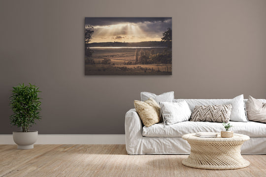 Canvas photo wall art of New Zealand landscape image  in lounge setting with a grey wall, white couch, coffee table, plant, cushions