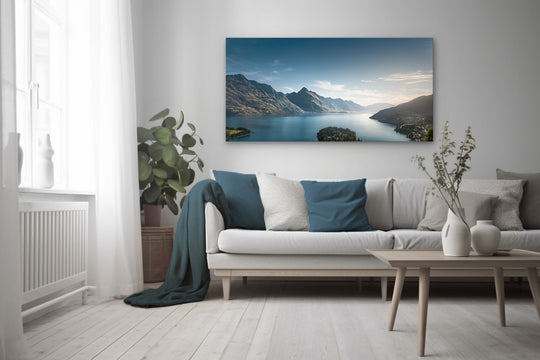 Large wall art of Lake Wakatipu in Queenstown displayed in a living room, showcasing a tranquil New Zealand landscape with mountains and lake reflecting soft natural light.