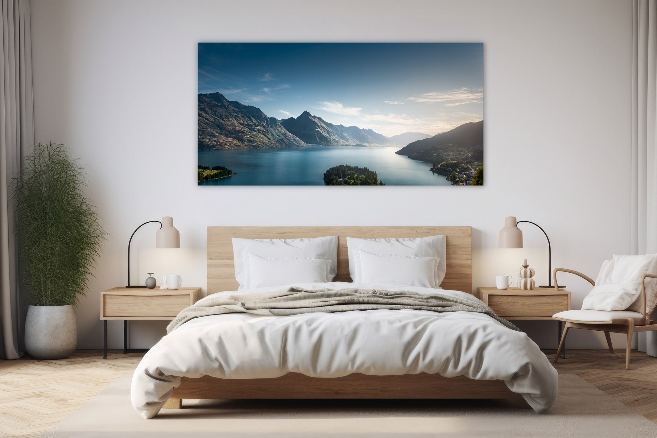 Landscape print of Lake Wakatipu in Queenstown hanging above a bed, bringing a calm and serene New Zealand mountain and lake scene into a modern bedroom interior.