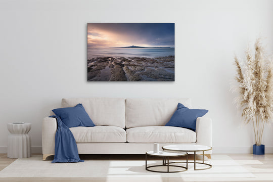 New Zealand landscape photo canvas wall art in neutral lounge setting with a white couch, cushions, coffee tables and plant