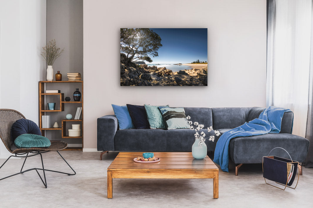 Canvas photo print on lounge wall, with a lounge suite and coffee table in the room.