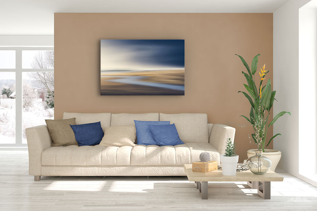 New Zealand landscape canvas photo wall art in lounge setting with a brown wall, white couch, coffee table, plant, cushions