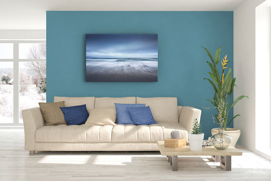 Canvas photo print of an abstract ocean scene on display on living room wall