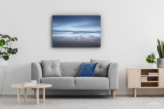 Canvas photo print of an abstract ocean scene on display on lounge room wall