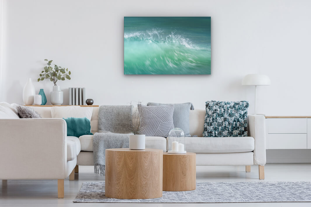 Neutral decor lounge with canvas print on the wall showing abstract New Zealand wave crest.