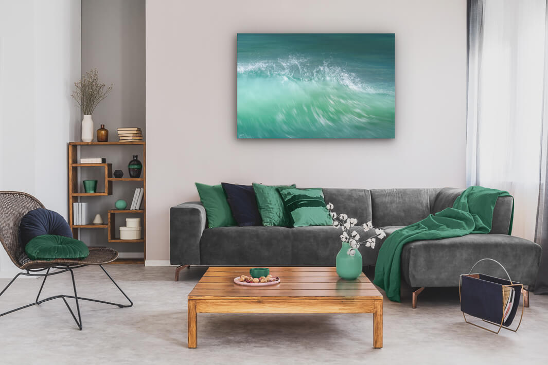 Abstract canvas print of aqua coloured New Zealand wave crest on lounge wall.