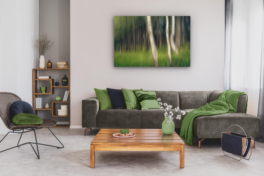 Lounge wall with a large canvas print of an abstract forest