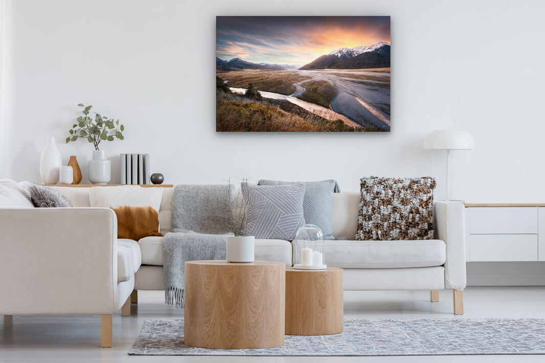 Canvas wall art of Arthurs Pass mountains and river displayed on a lounge wall.