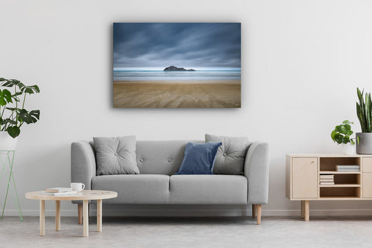 Modern couch in lounge with canvas photo print wall art of Bare Island, Waimarama Beach in Hawkes Bay