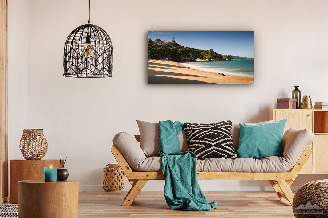 Wall art photo print of a landscape photo of Breaker Bay in Kaiteriteri, New Zealand, on a modern lounge wall