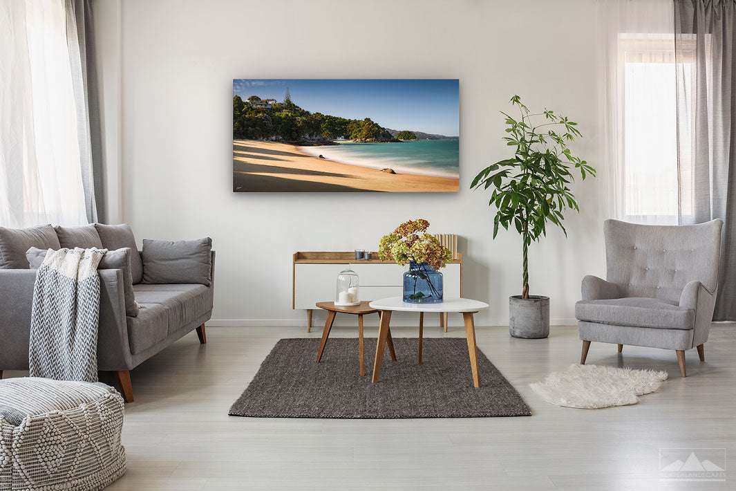 Canavs wall art of a landscape photo of Breaker Bay in Kaiteriteri, New Zealand, on a modern lounge wall