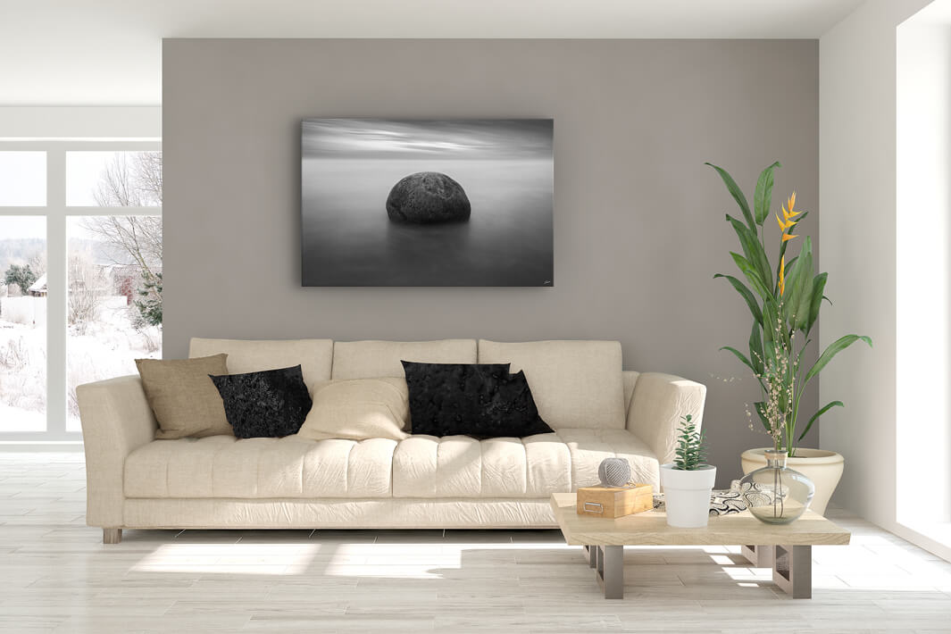 Canvas wall art of a Moeraki boulder up on a lounge wall