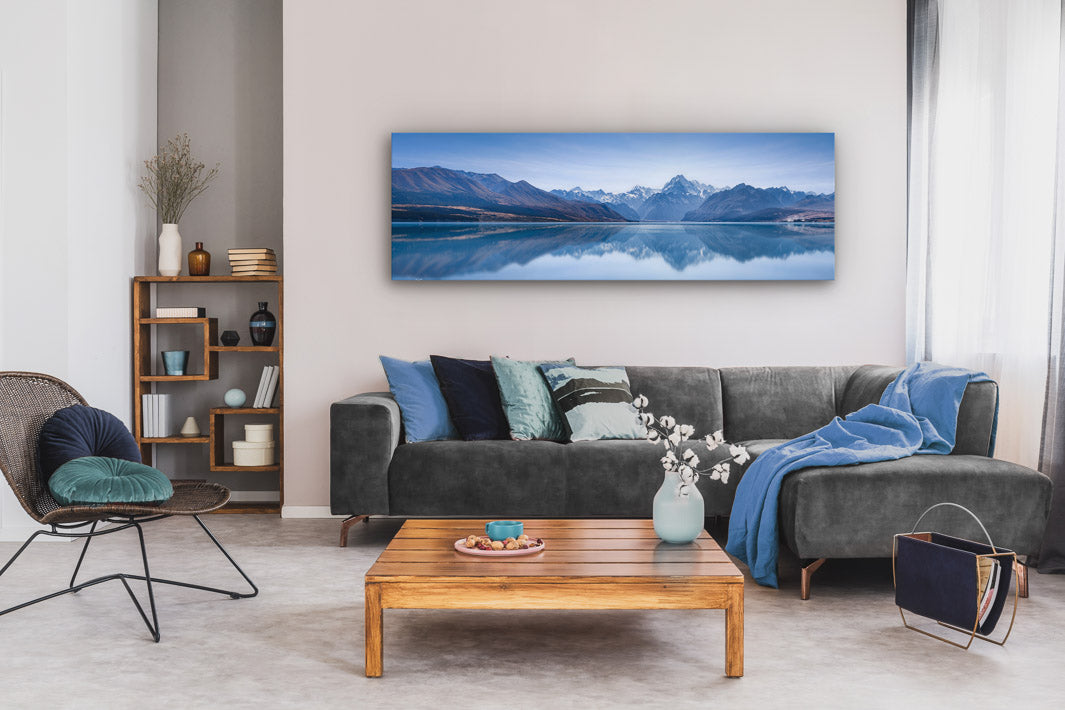 Large panoramic photo wall art on display in a modern lounge with furniture