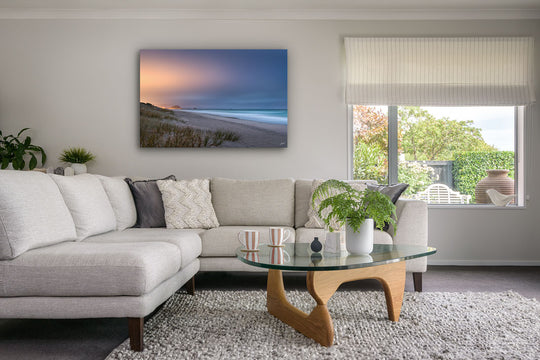 Modern neutral living room with photo print canvas on wall of Mount Maunganui and Papamoa Beach