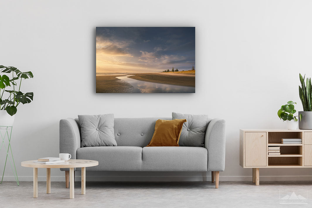 Landscape canvas wall print of Waihi Beach mounted on a modern contemporary lounge wall