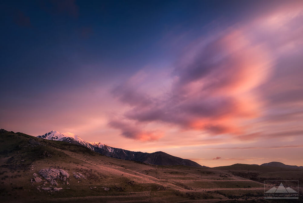 New Zealand landscape photo of sunset clouds in a pink colour
