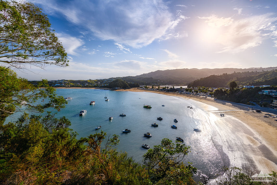 Landscape view looking down over Kaiteriteri beach and boats in summer