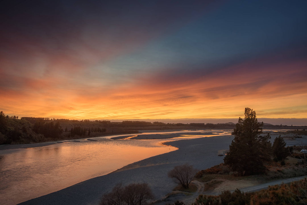 Morning bright sunrise looking out across the Waimak river in Canterbury, NZ